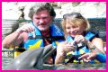 Goldie Hawn Rocks a Red Swimsuit at Age 67, Feeds Dolphins With Kurt Russell